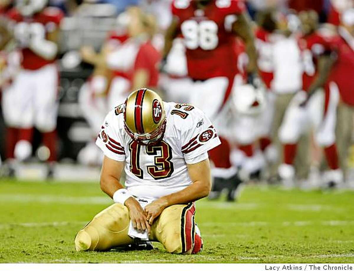 San Francisco 49ers quarterback Shaun Hill bows his head on the ground after throwing a interception in the third quarter against the Arizona Cardinals, Monday Nov. 10, 2008, in Phoenix, Az. The interception lead to the Cardinals touchdown.