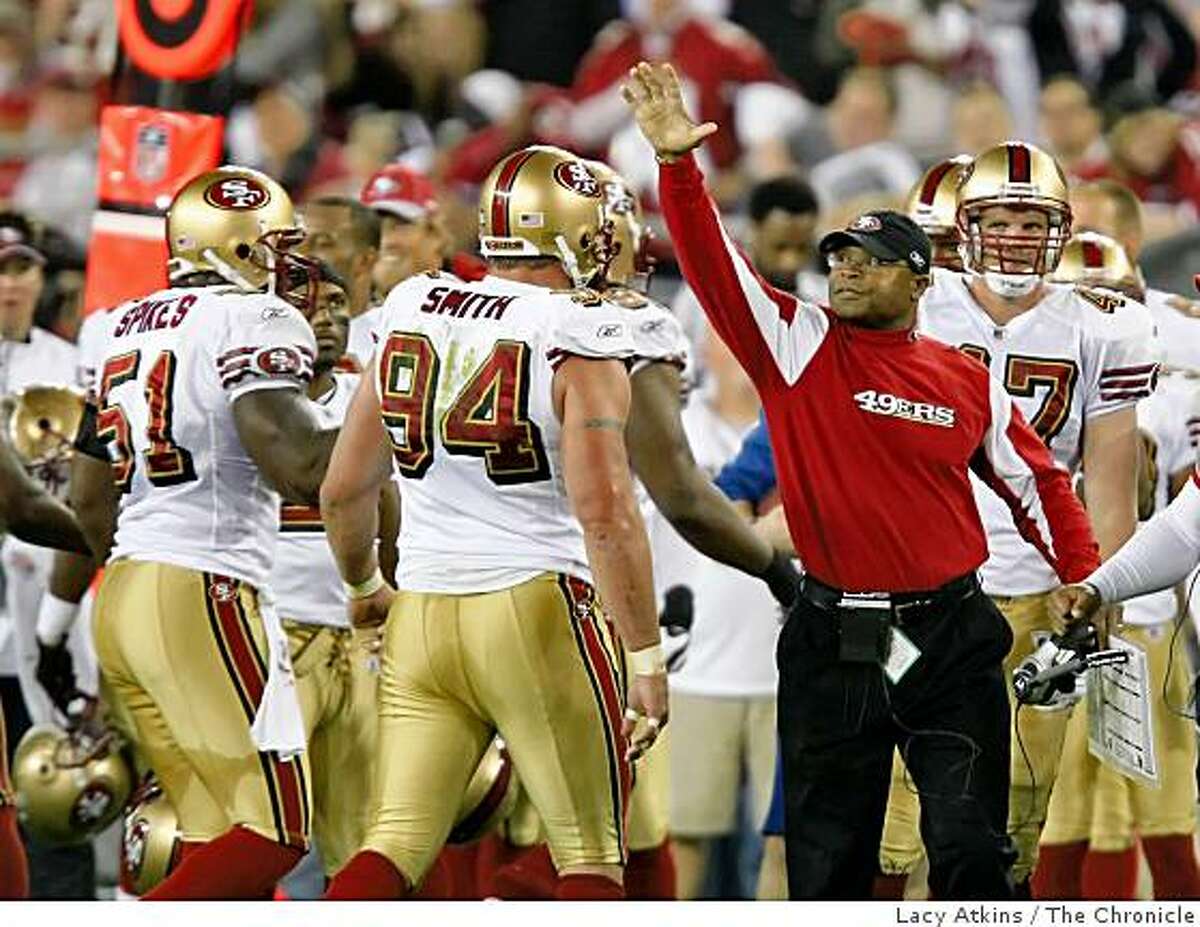 San Francisco 49ers coach Mike Singletary congratulates his defense for stopping the Arizona Cardinals, Monday Nov. 10, 2008, in Phoenix, Az.