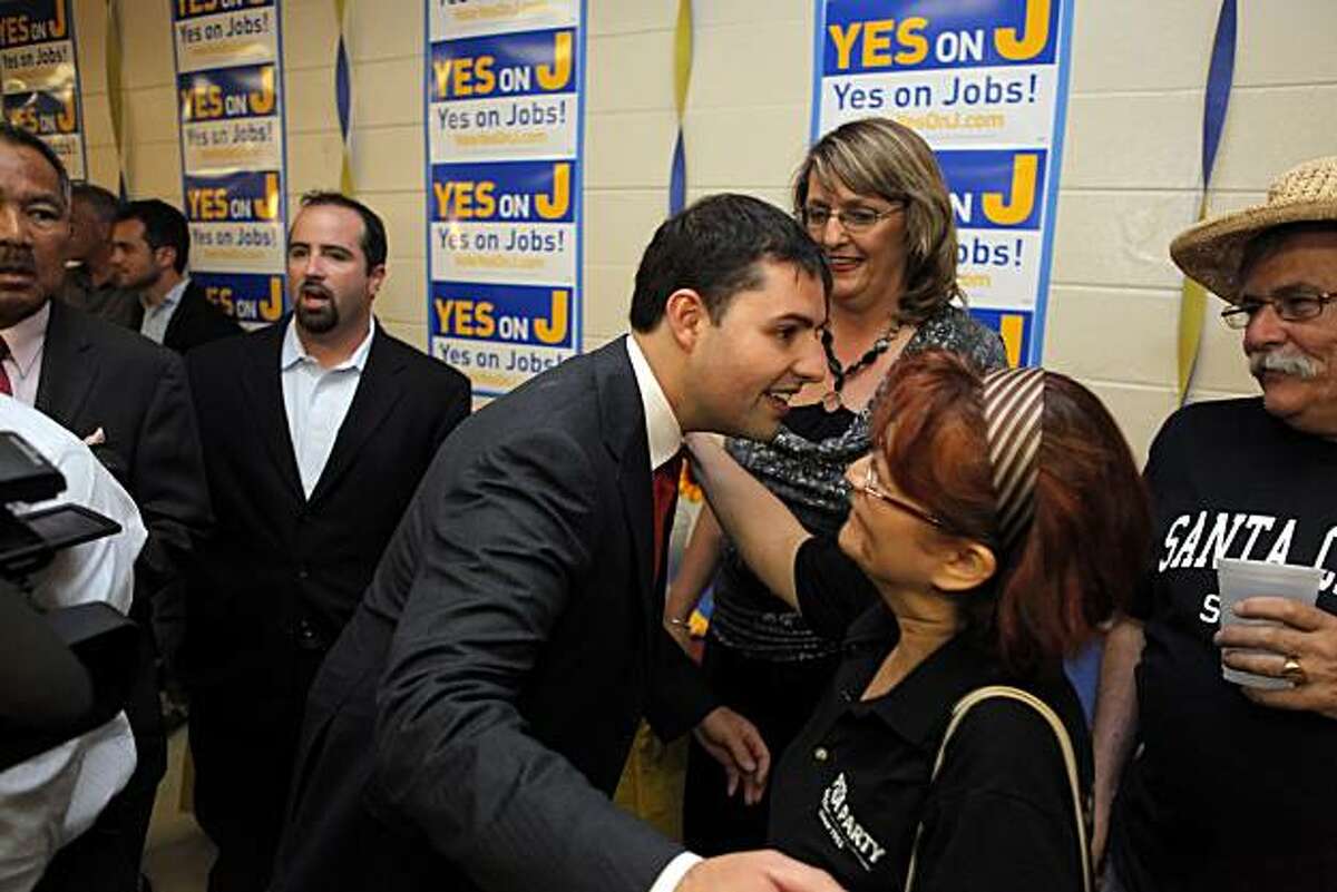 Jed York hugs Lidia Blair as elections results for Measure J come in at the American Legion Hall in Santa Clara on Tuesday.