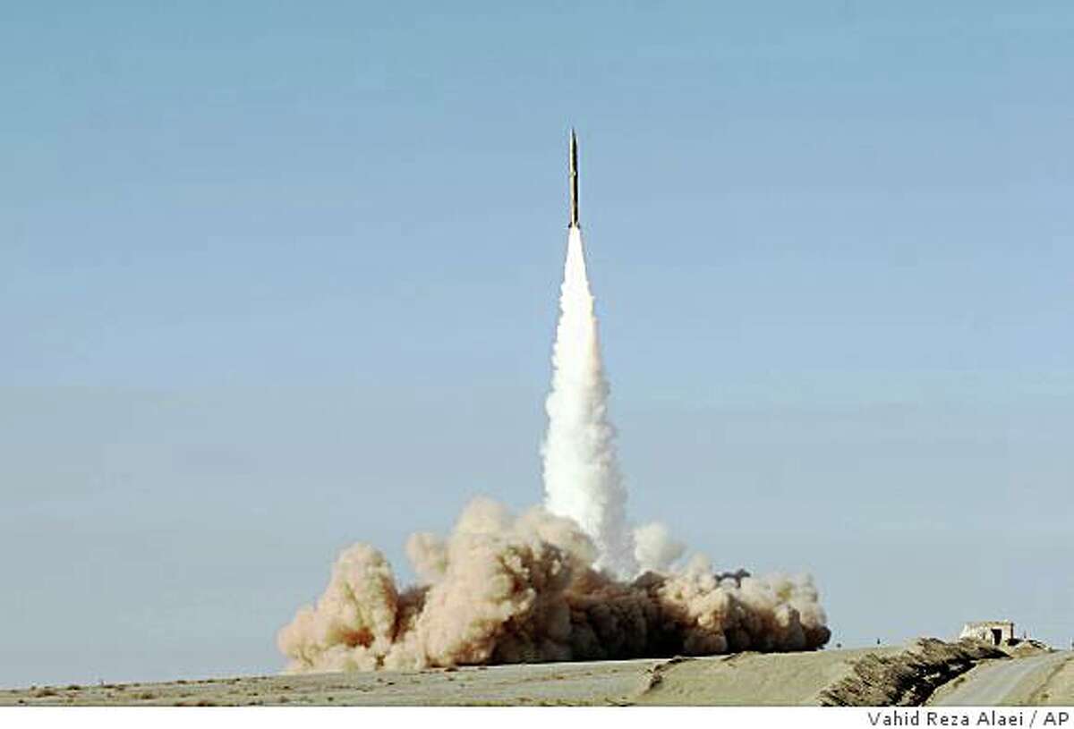 This is an images released Wednesday Nov. 12, 2008 taken at an undisclosed location in Iran, showing a missile test fire by Iranian armed forces. Iran has successfully test-fired a new generation of long range surface-to-surface missile using solid fuel, making them more accurate than its predecessors, the defense minister announced Wednesday. Mostafa Mohammed Najjar said on state television that the Sajjil was a high-speed missile manufactured at the Iranian Aerospace department of the Defense Ministry. He said it had a range of about 1,200 miles (2,000 kilometers). (AP Photo/Fars News Agency, Vahid Reza Alaei)