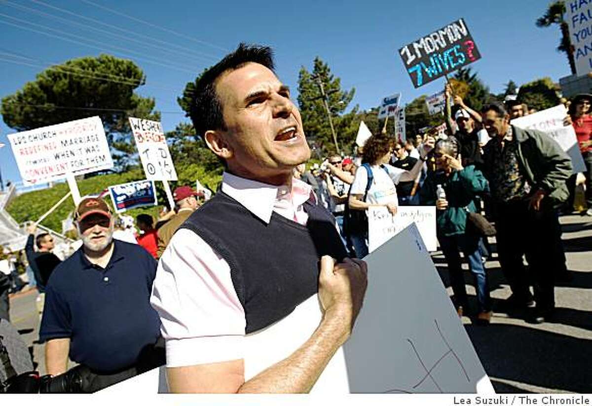 Scott Pettigrew of Berkeley shouts at a vehicle driving past the protest to the Oakland Mormon Temple while gathered outside with other protesters at the Oakland Mormon Temple to protest the passage of Proposition 8 on Sunday, November 9, 2008 in Oakland, Calif.