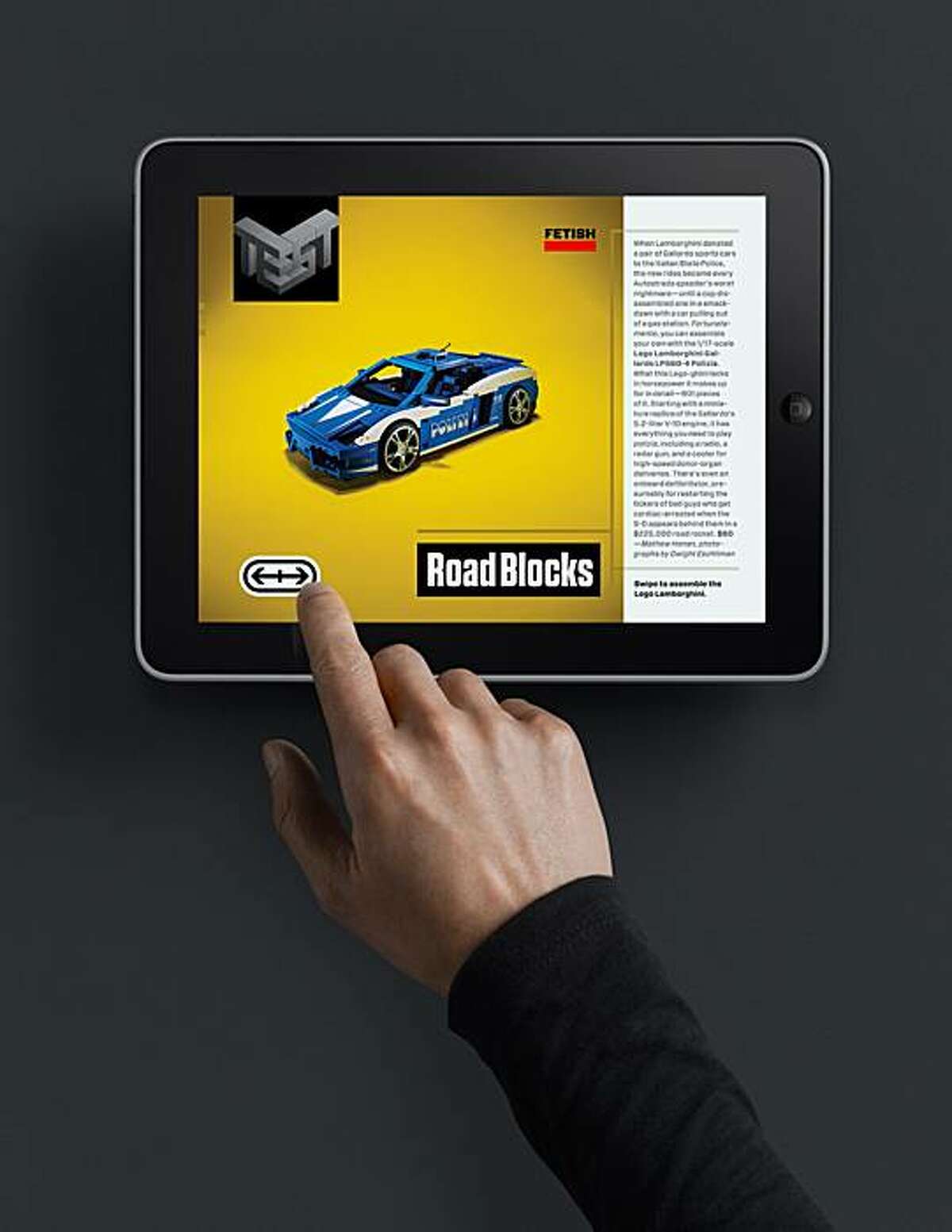 In this undated photo provided by Wired, a person demonstrates the use of an Apple iPad. After nearly a year of laboring on a tablet computer edition of the magazine, Wired released its application in Apple's digital newsstand Wednesday, May 26, 2010. Other titles from Conde Nast, including Vanity Fair and GQ, had already come out for the iPad, which launched April 3. But Wired is the first to undergo a top-to-bottom re-imagining for the new format.