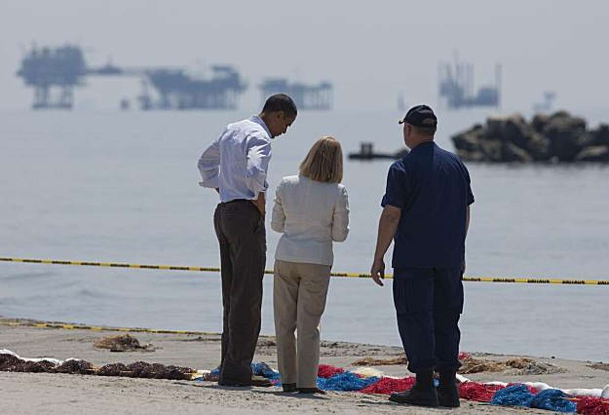 President Barack Obama, left, LaFourche Parish Charlotte Randolph, center, and U.S. Coast Guard Admiral Thad Allen, National Incident Commander for the BP Deepwater Horizon oil spill, take a tour of areas impacted by the Gulf Coast oil spill on Friday, May 28, 2010 in Port Fourchon, La.