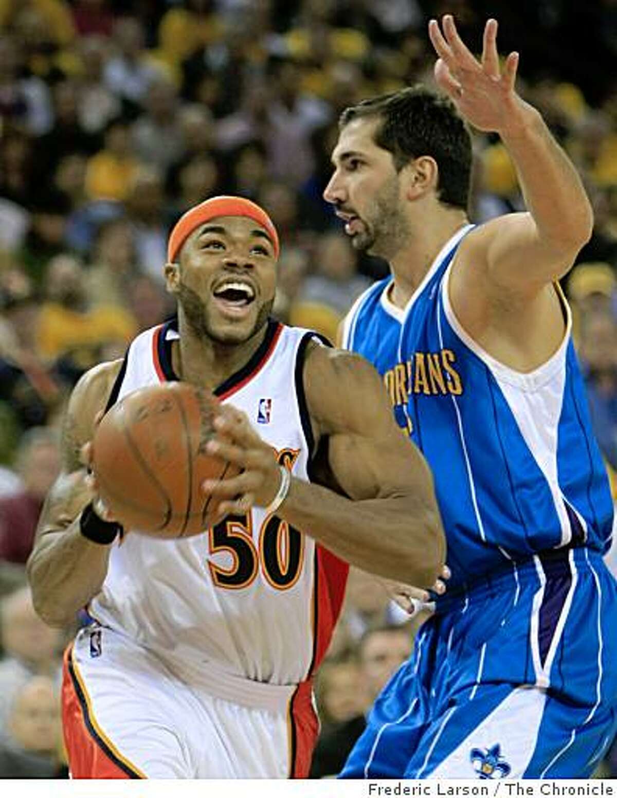 Corey Maggette (50) Golden State Warriors runs pass Peja Stojakovic (16) of the New Orleans Hornets in the first quarter of action at the Oracle Arena in Oakland Calif., on Wednesday October 29, 2008.