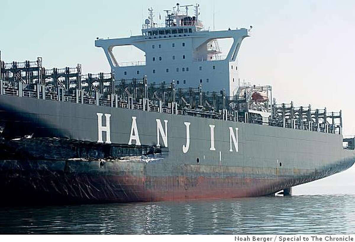 An approximately 90-foot long gash stretches down the Cosco Busan's hull as it rests at anchor on Tuesday, Nov. 13, 2007, in the San Francisco Bay, Calif.