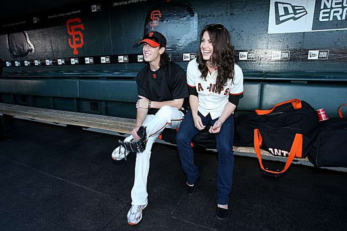 SAN FRANCISCO - AUGUST 26: Tim Lincecum #55 (L) of the San Francisco Giants speaks with childhood friend and actress Vicki Noon in the dugout before their game against the Arizona Diamondbacks at AT&T Park on August 26, 2009 in San Francisco, California. Noon is currently playing Elphaba in Wicked. (Photo by Ezra Shaw/Getty Images for Reebok)