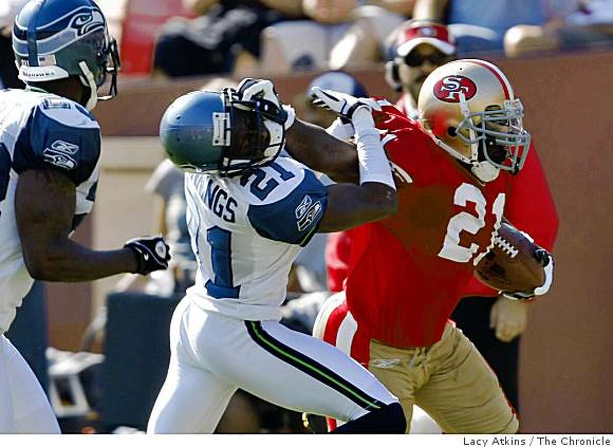 San Francisco 49ers Frank Gore gets a first down in the first half but then the play is called back because of a flag for facemask against Seattle Seahawks' Kelly Jennings, at Candlestick Park, Sunday Oct. 26, 2008, in San Francisco, Calif.