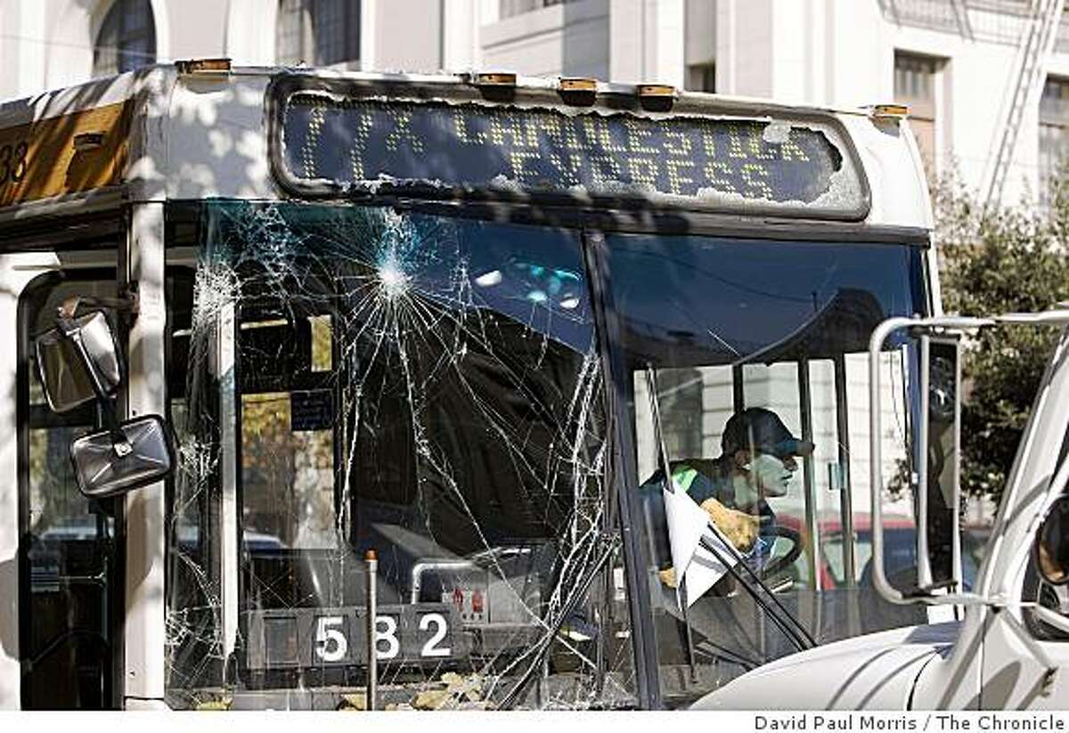 A tow truck driver gets the MUNI bus 76X ready for towing after it crashed driving southbound on Van Ness at Geary October 26, 2008 in San Francisco, California. A total of 6 people were taken to the hospital as a result of the accident. Photograph by David Paul Morris / The Chronicle