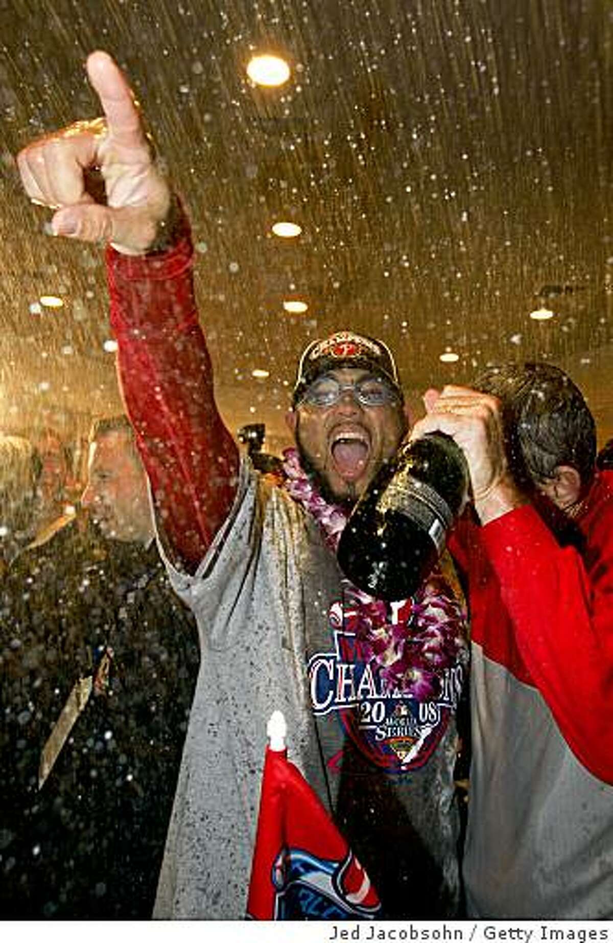Pedro Feliz celebrates winning the World Series in the locker room at Citizens Bank Park in Philadelphia.