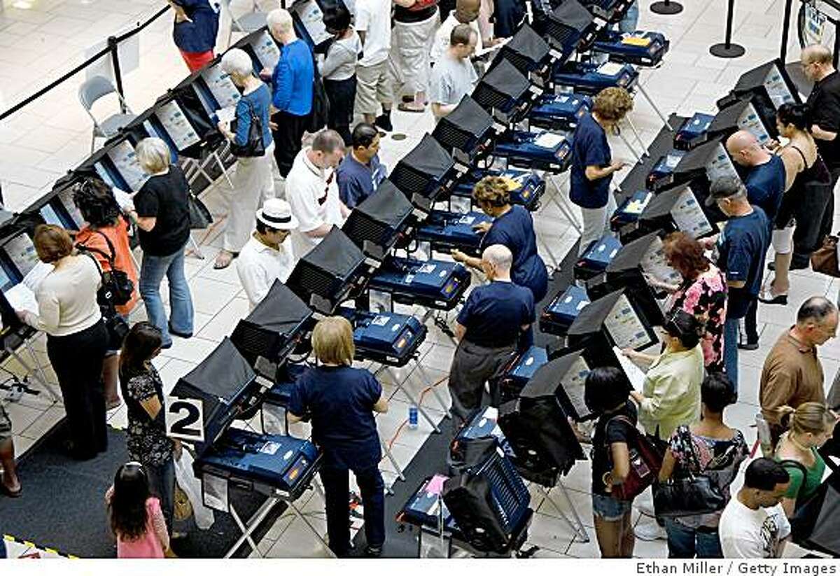 LAS VEGAS - OCTOBER 29: People vote early at the Meadows Mall October 29, 2008 in Las Vegas, Nevada. As of October 28, more than 32% of the Nevada electorate had cast their ballots ahead of the November 4 general election. (Photo by Ethan Miller/Getty Images)