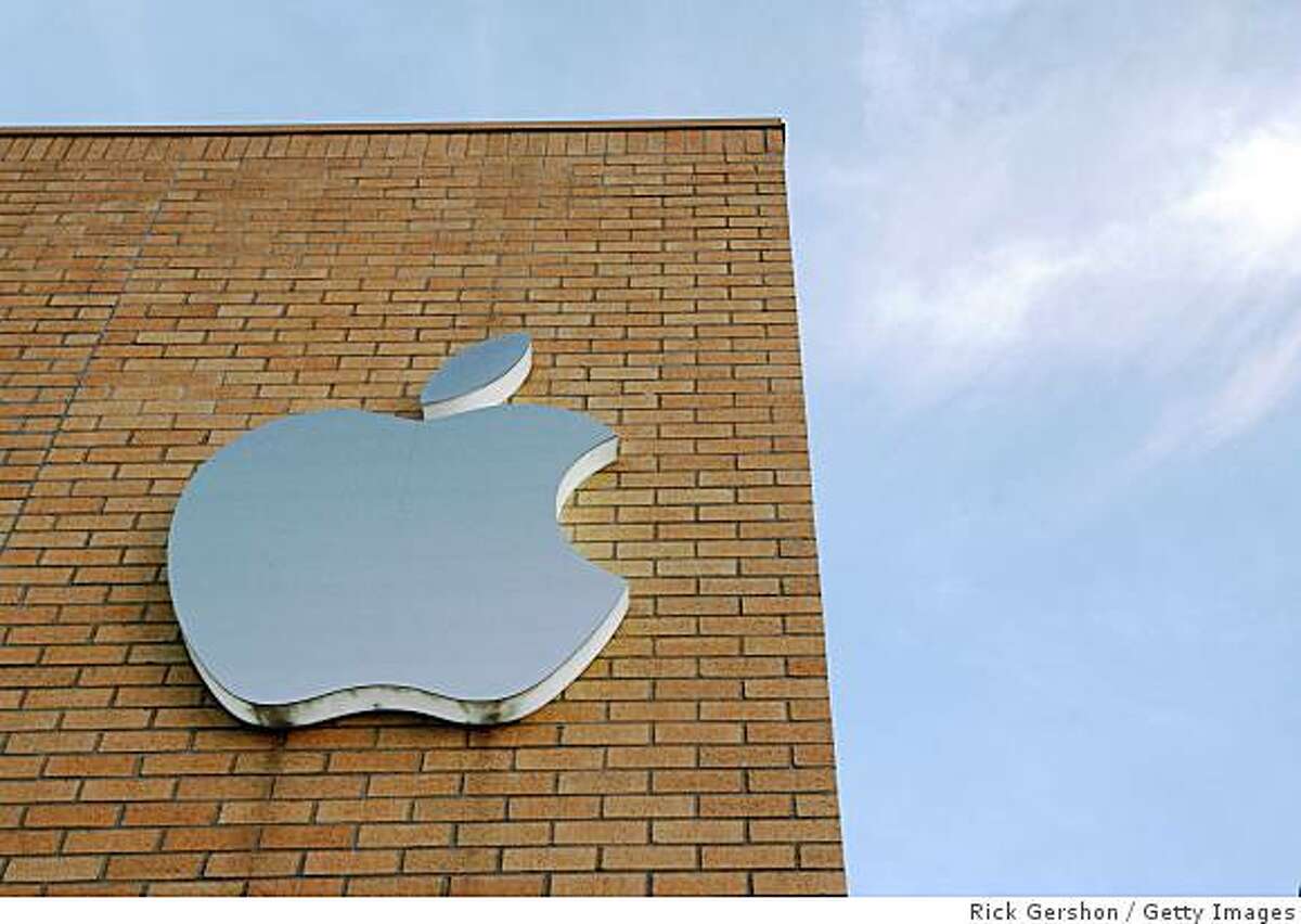 DALLAS - JULY 11: (FILE PHOTO) The Apple logo is illuminated on the side of the Apple Store at daybreak July 11, in Dallas, Texas. Apple announced a 26 percent profit increase in the last quarter, much of which can be attributed to iPhone sales. (Photo by Rick Gershon/Getty Images)