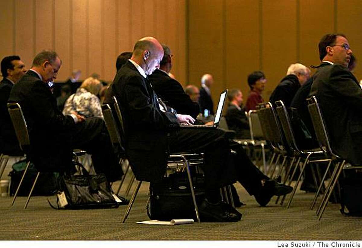 Mike Murray of Washington DC., with MBA Newslink, works on his computer during the morning General Session at the Mortgage Bankers Association's annual convention at Moscone West on Monday October, 20 2008 in San Francisco, Calif.