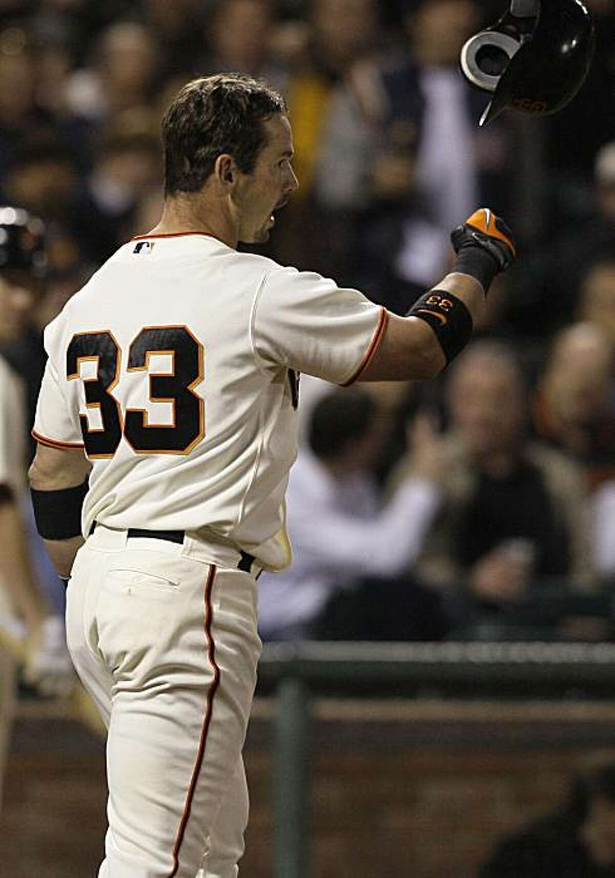 San Francisco Giants' Aaron Rowand throws his helmet after striking out against San Diego Padres' Clayton Richard to end the fifth inning of a baseball game in San Francisco, Wednesday, May 12, 2010.