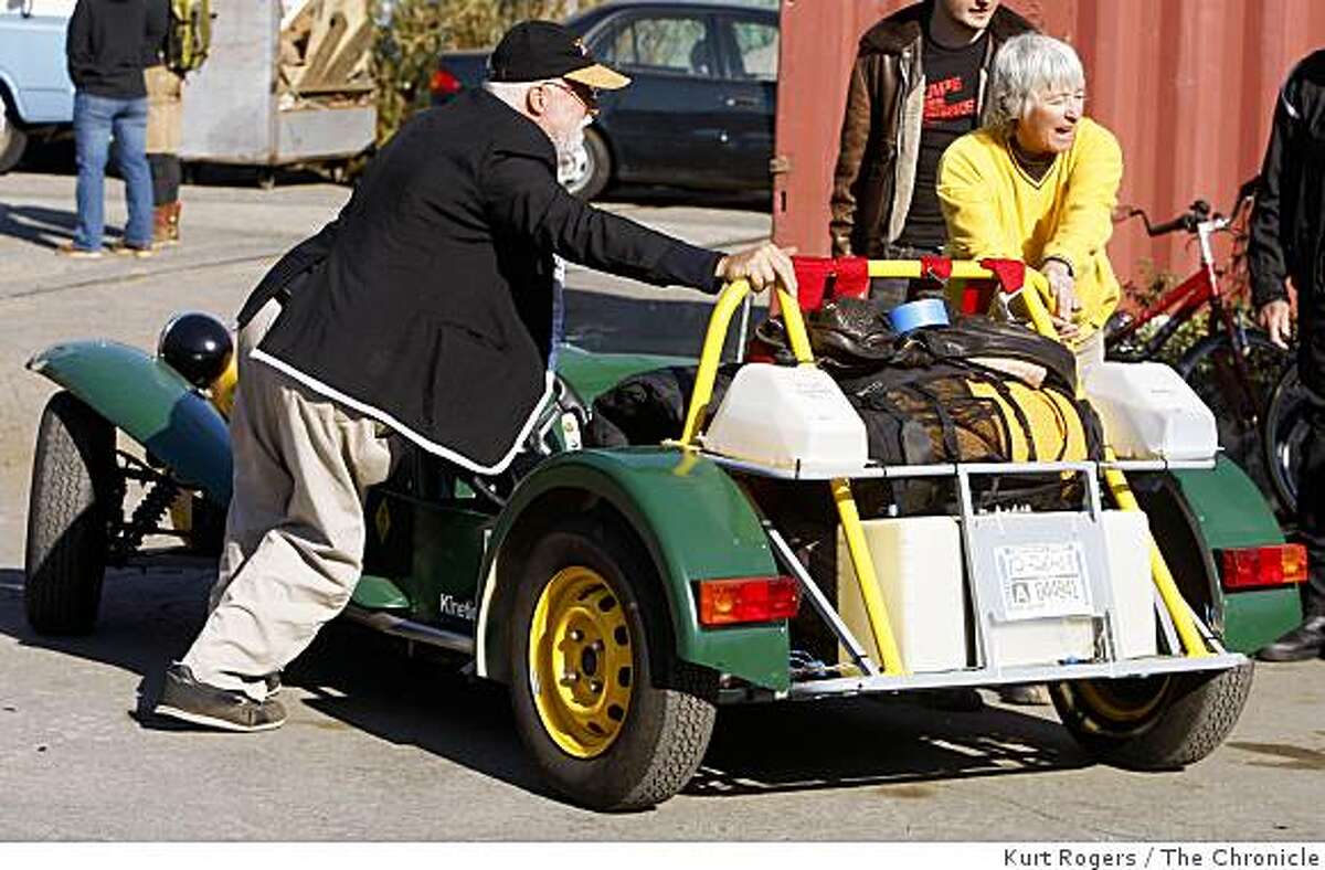 Jack McCornack and Sharon Westcott, of Cave Junction, Ore., back their canola oil-powered Lotus Seven roadster on Saturday, October 11, 2008 into the yard at Shipyard Labs in Berkeley, Calif., for the start of the Escape from Berkeley race.