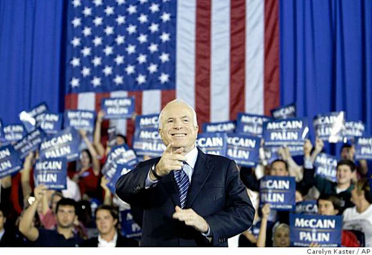 Republican presidential candidate, Sen. John McCain, R-Ariz., gestures to the crowd as he is being introduced at a rally at Cape Fear Community College in Wilmington, N.C., Monday, Oct. 13, 2008. (AP Photo/Carolyn Kaster)