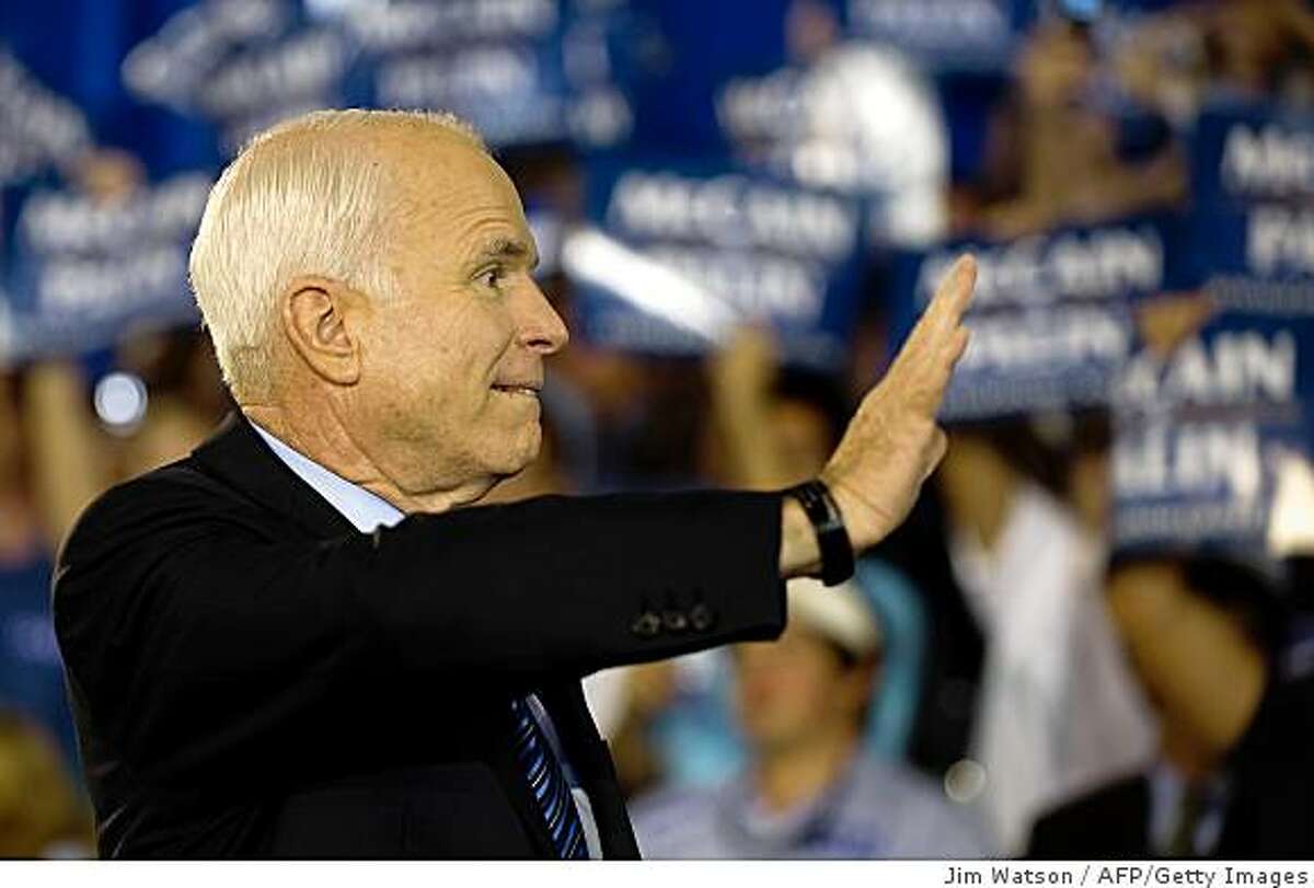 US Republican Presidential Candidate John McCain waves to supporters during a rally in Virginia Beach,Virginia, 13, 2008. AFP PHOTO/Jim WATSON (Photo credit should read JIM WATSON/AFP/Getty Images)