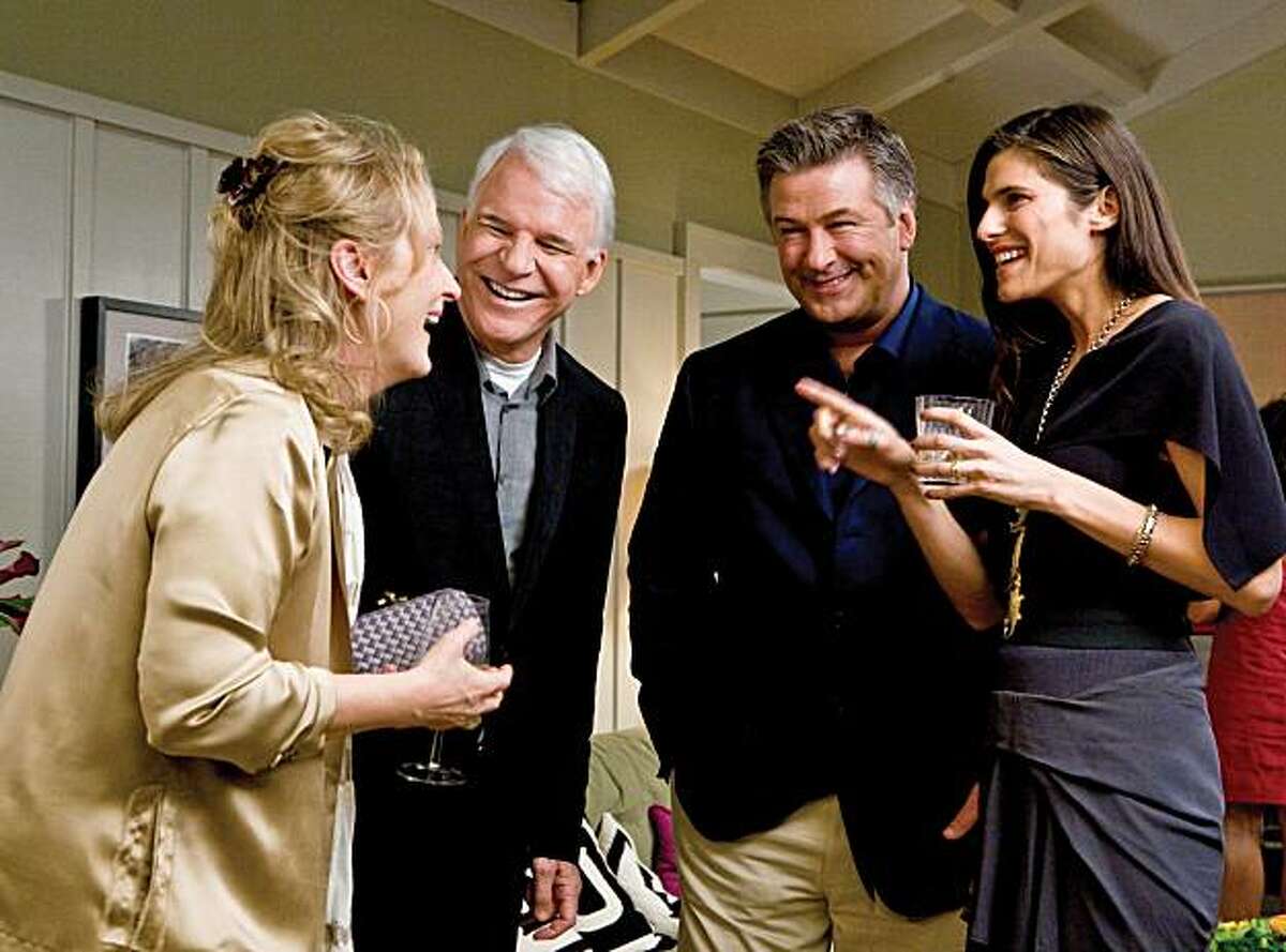 (Left to right) Jane (Meryl Streep), Adam (Steve Martin), Jake (Alec Baldwin) and Agness (Lake Bell) share a scene in the comedy "It's Complicated." (MCT)