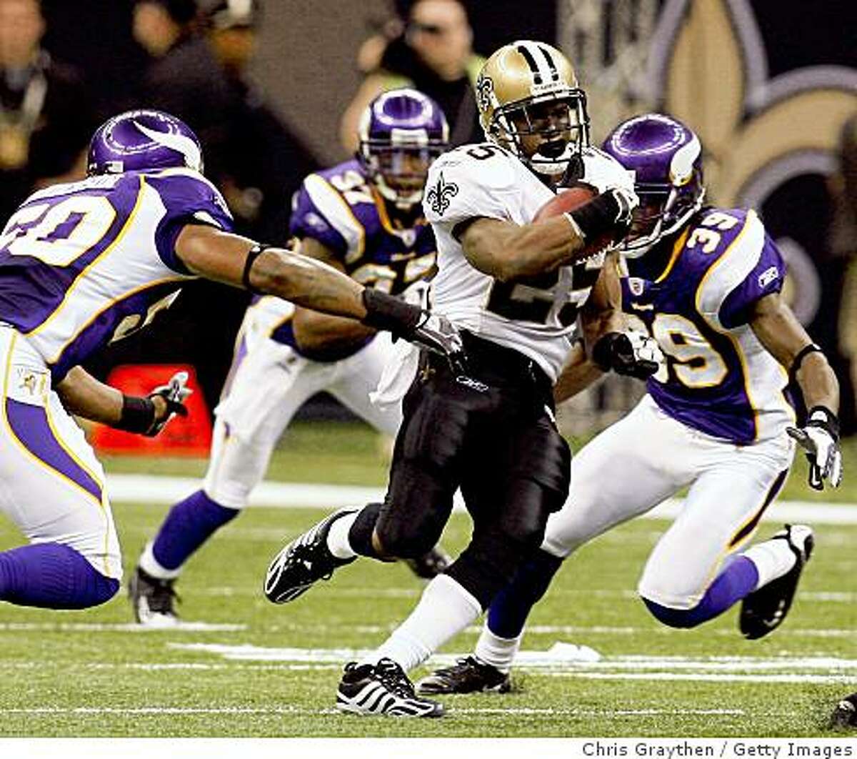 NEW ORLEANS - OCTOBER 06: Reggie Bush #25 of the New Orleans Saints gets past Erin Henderson #50 of the Minnesota Vikings on October 6, 2008 at the Superdome in New Orleans, Louisiana. Bush tied an NFL record by returning two punts for touchdowns in a game. The Vikings defeated the Saints 30-27. (Photo by Chris Graythen/Getty Images)