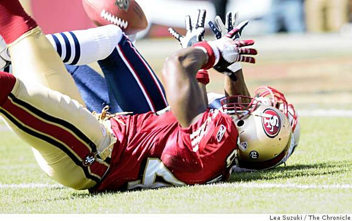 J.T. O'Sullivan pass intended for San Francisco 49ers Delanie Walker (46), foreground, intercepted by New England Patriots Brandon Meriweather (31) in the first quarter on Sunday, October 5, 2008 in San Francisco, Calif. Final score: San Francisco 49ers 21 to New England Patriots 30.