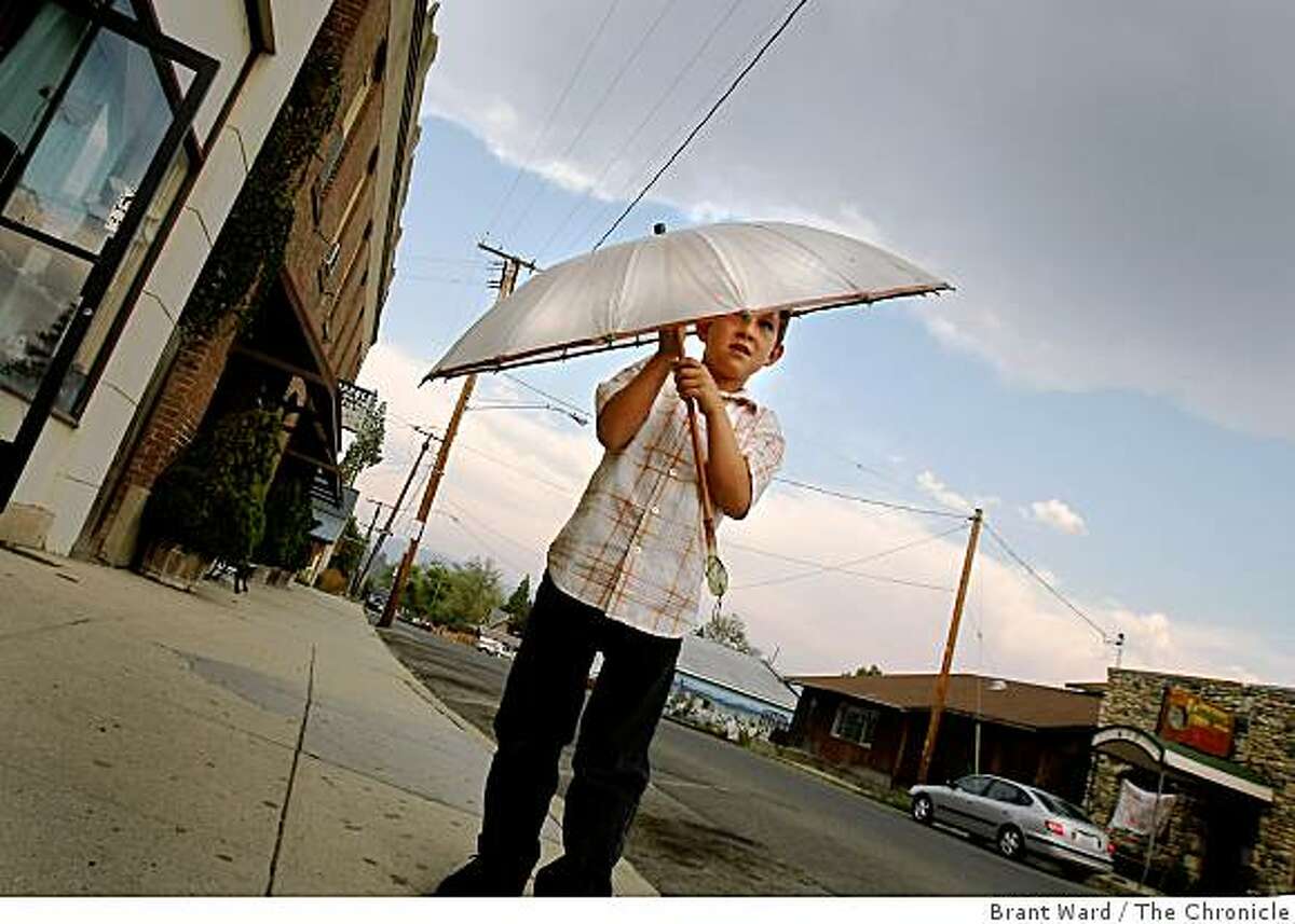 Matthew Martin uses an umbrella to shield him from a brief rainstorm in Etna, California. Matthew's father is a proponent of a new state of Jefferson. Some residents of northern California and southern Oregon are again talking about seceding from the United States and forming their own state called Jefferson.