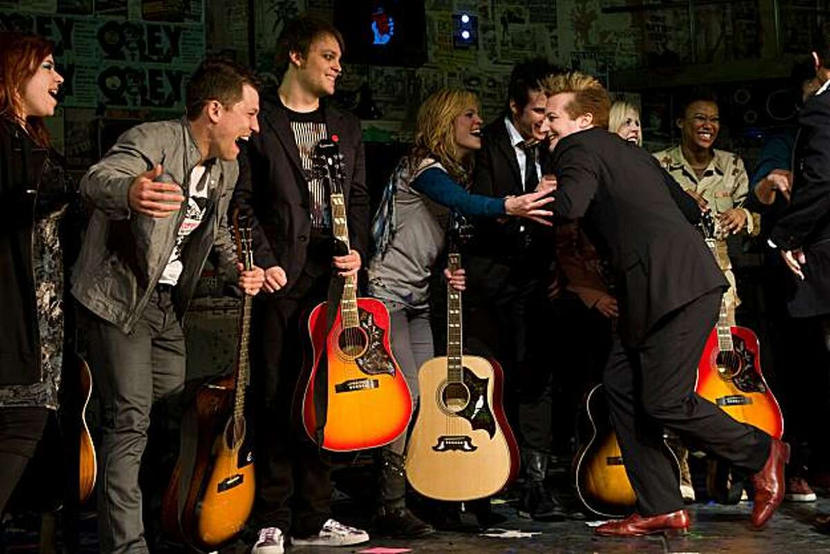 Green Day member Tre Cool greets cast members at the curtain call for the opening night performance of the Broadway musical 'American Idiot' in New York, Tuesday, April 20, 2010.