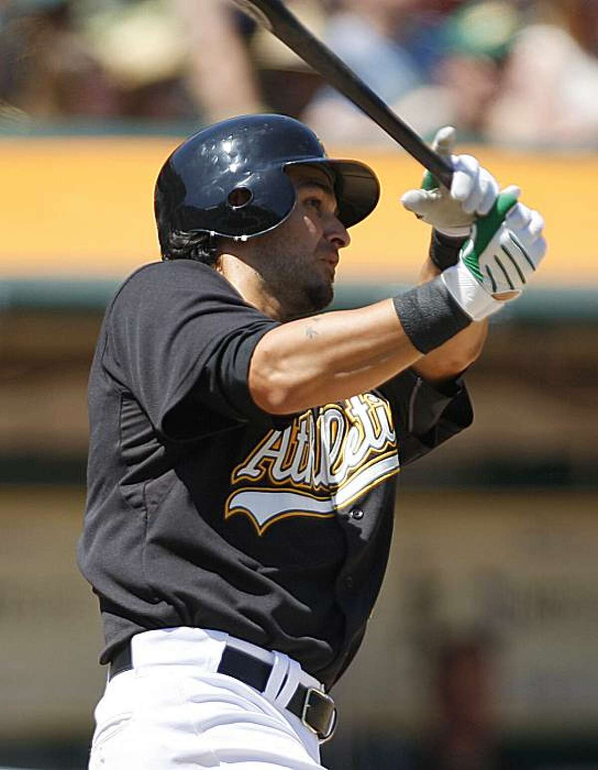 Oakland Athletics' Eric Chavez connects for an RBI off Cleveland Indians' Justin Masterson during the third inning of a baseball game Sunday, April 25, 2010, in Oakland, Calif.
