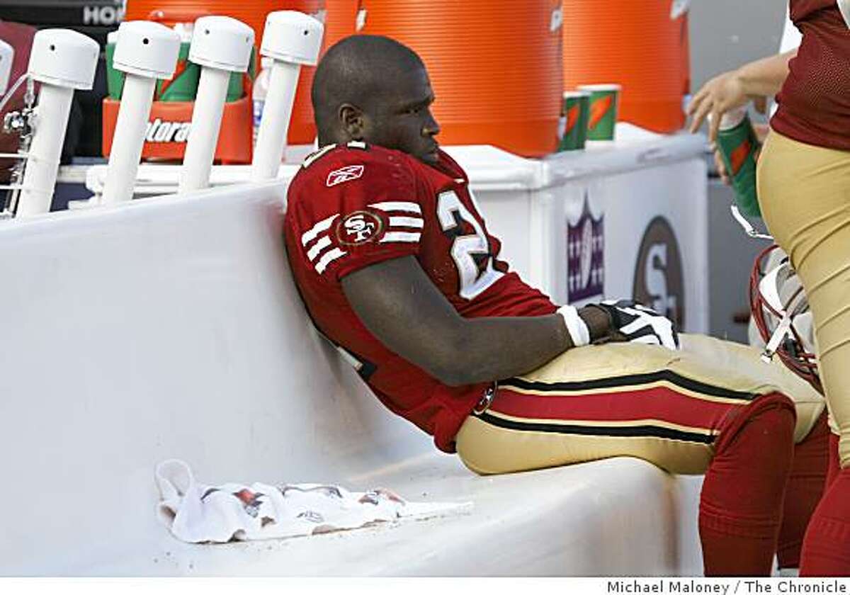 San Francisco 49ers Frank Gore (21) sits alone on the bench in the closing minutes of a NFL game against the New England Patriots at Candlestick Park in San Francisco, Calif., on October 5, 2008.