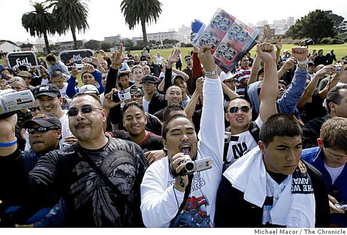 Fans cheers on their favorite boxers Oscar De la Hoya and Manny Pacquiao who are attending a press coference and rally at the Great Meadow at Fort Mason in San Francisco, Calif. on Saturday Oct. 4, 2004 to promote their upcoming fight in Las Vegas on Dec. 6.