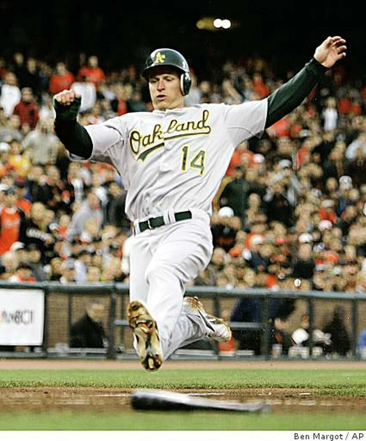 Oakland Athletics' Mark Ellis slides to score during the third inning of a baseball game against the San Francisco Giants Friday, June 13, 2008, in San Francisco. Ellis scored on a sacrifice fly by Jack Cust. (AP Photo/Ben Margot)