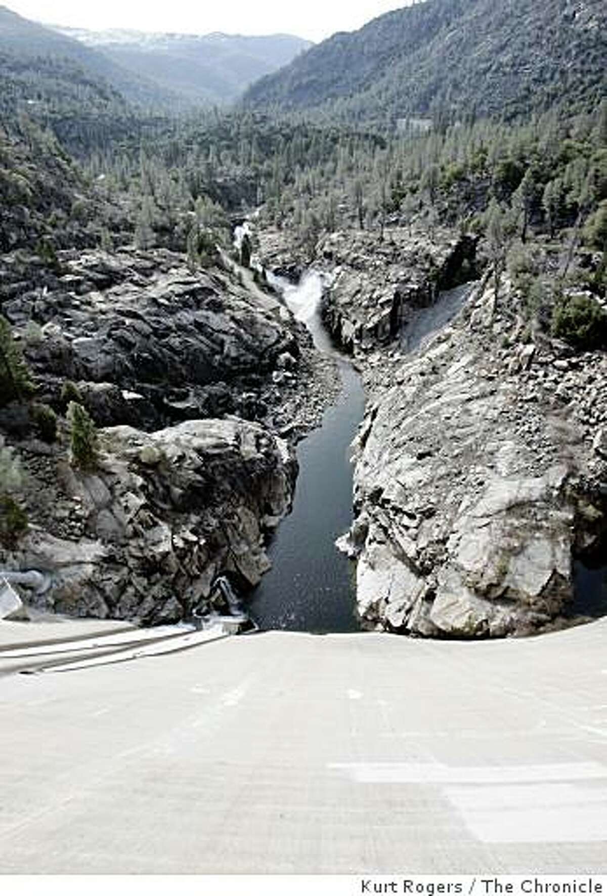 The O'Shaughnessy Dam is in Hetch Hetchy Valley, in the Grand Canyon of the Tuolumne River in Yosemite National Park. This view looks down the face of the dam at the Tuolumne River below.