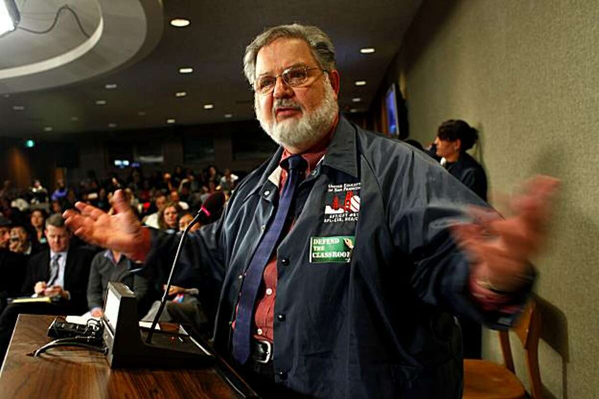 Dennis Kelly, President of the Unified Education of San Francisco Union, addresses the superintendent and other members of the school board Tuesday Jan. 26, 2010, in San Francisco. Kelly was among an angry crowd that were protesting the proposed budget cuts.