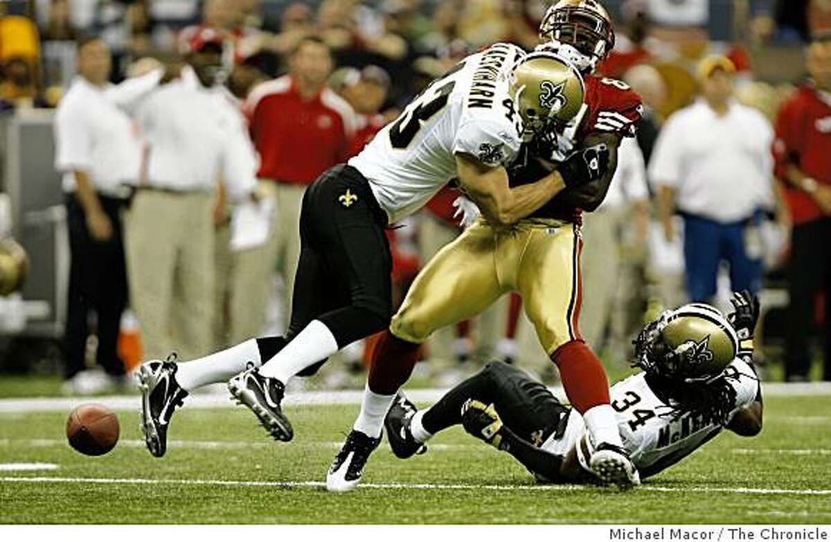 San Francisco 49ers Josh Morgan is hit by New Orleans Saints Kevin Kaesviharn (43) and looses the ball, also covered by New Orleans Saints Mike McKenzie (34) at the New Orleans Superdomein new Orleans, La. on Sunday Sept.28, 2008.