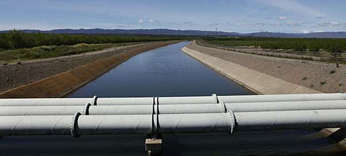 A water cannel passes through Arbuckle, Calif., as it delivers water to farmers on Tuesday, April 6, 2010.