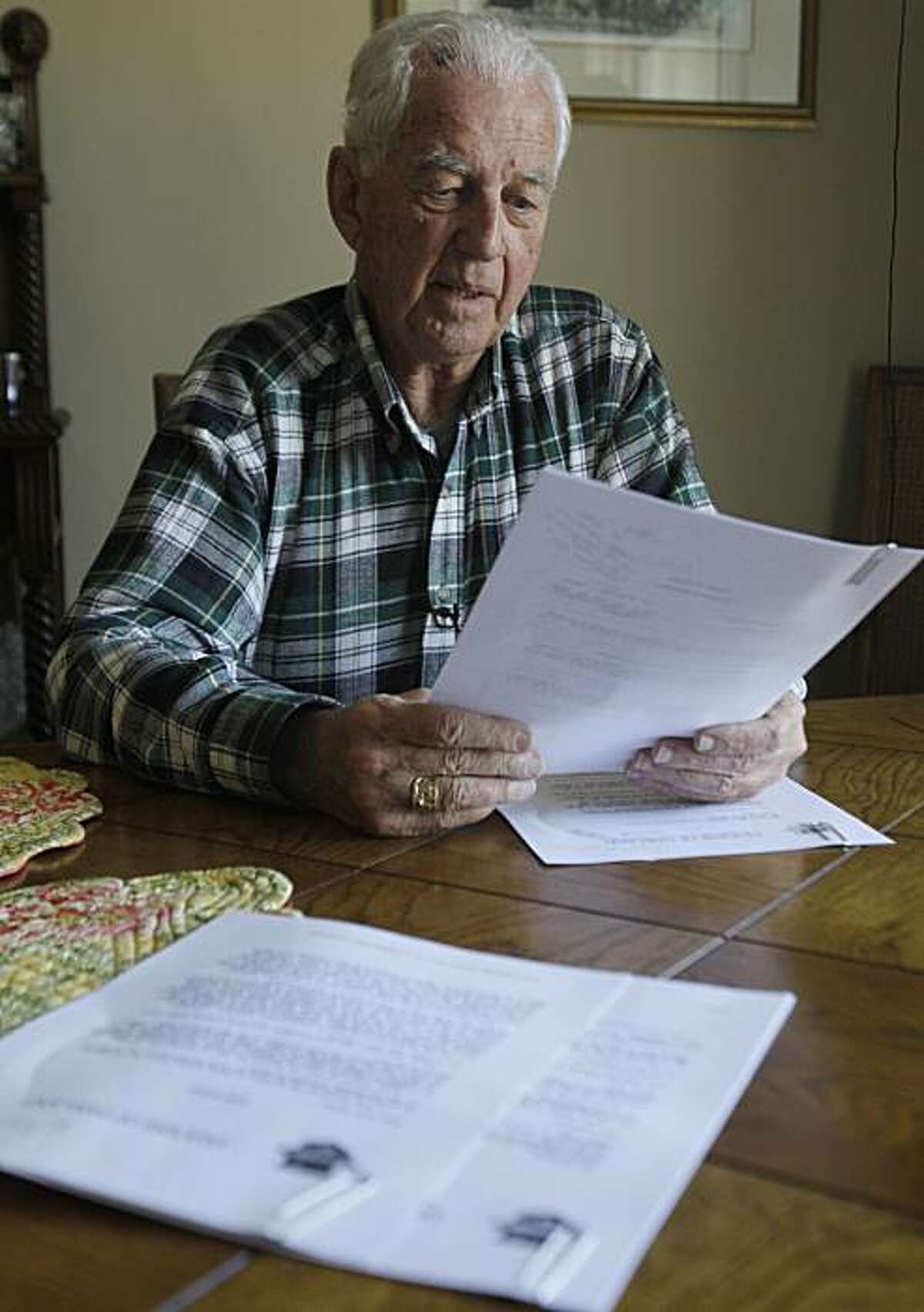 John S. Cummins, former bishop of the diocese of Oakland, Calif., recalls correspondence from Cardinal Joseph Ratzinger regarding troubled priest Stephen Kiesle as he looks over copies of a document brought by the Associated Press to his home in Oakland,Calif. on Friday, April 9, 2010. A letter obtained by the AP and bearing the signature of future Pope Benedict XVI shows then-Cardinal Joseph Ratzinger resisted defrocking Kiesle, who had a record of sexually molesting children, after his case had languished for four years at the Vatican. The 1985 letter was typed in Latin and is part of years of correspondence between the Diocese of Oakland and the Vatican about the proposed defrocking of Rev. Kiesle. Cummins, 82 and now retired, initially told the AP