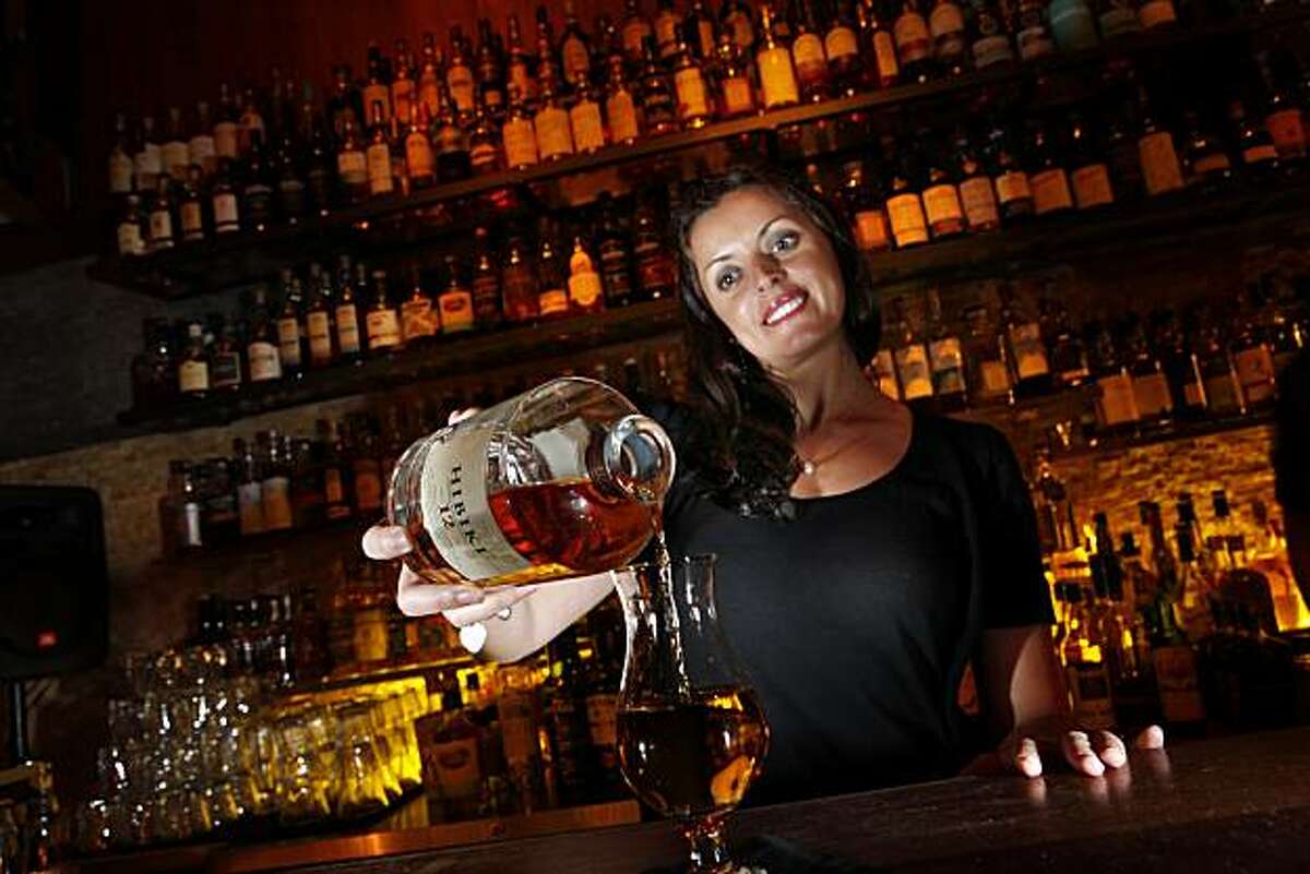 Romina Kluss pours a glass of Hibiki 12 at Nihon Whisky Lounge in San Francisco, Calif., on Tuesday, March 31, 2010. For a Food & Wine piece on Asian whiskies. The story details the rise of these whiskies, especially Japanese whiskey. Nihon specializes in these.