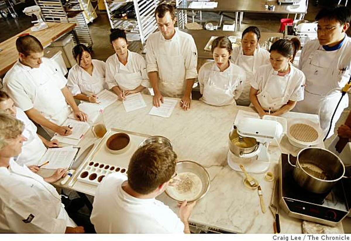 Brian Wood (bottom) teaching a class how to make a chocolate mousse cake at the San Francisco Baking Institute in South San Francisco, Calif., on September 9, 2008