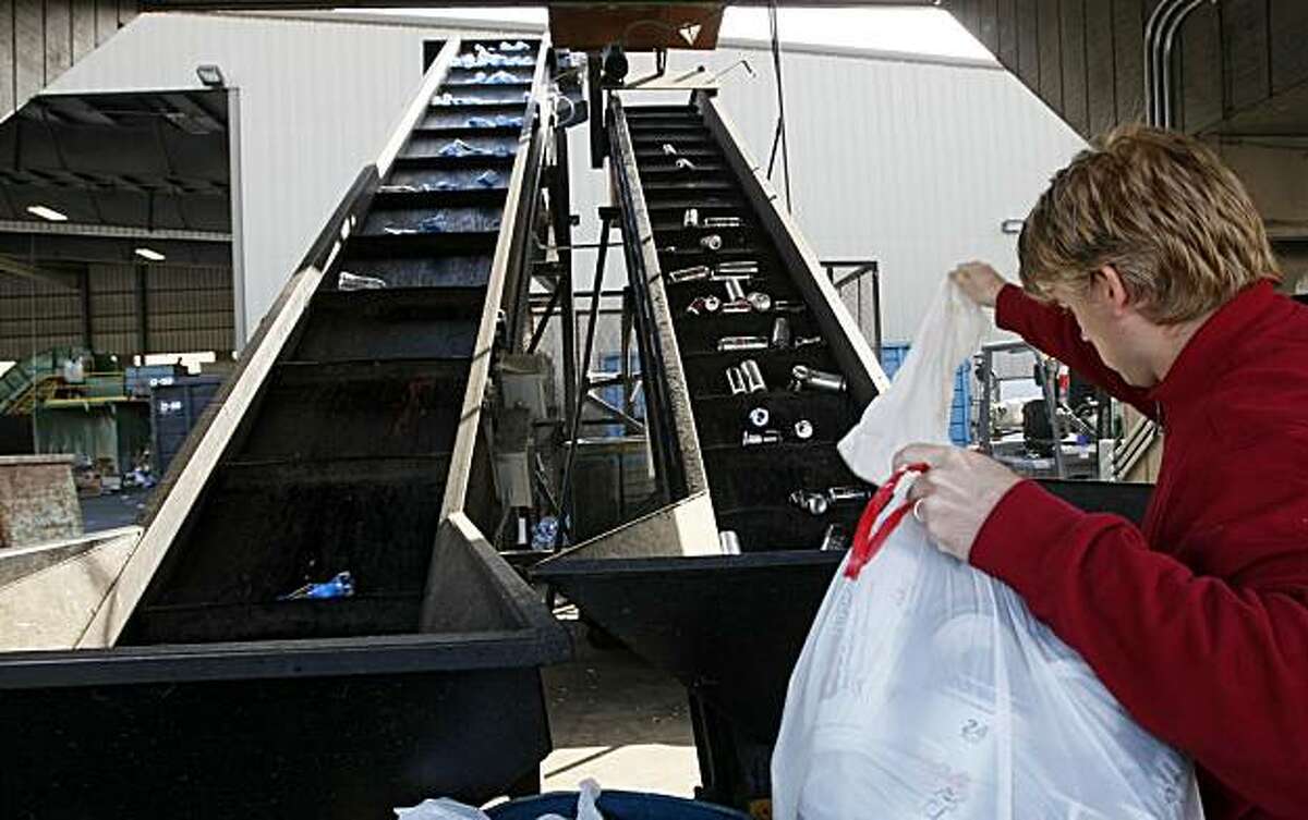 A Berkeley resident drops off aluminum cans at the Berkeley Recycling Center Tuesday March 23, 2010.