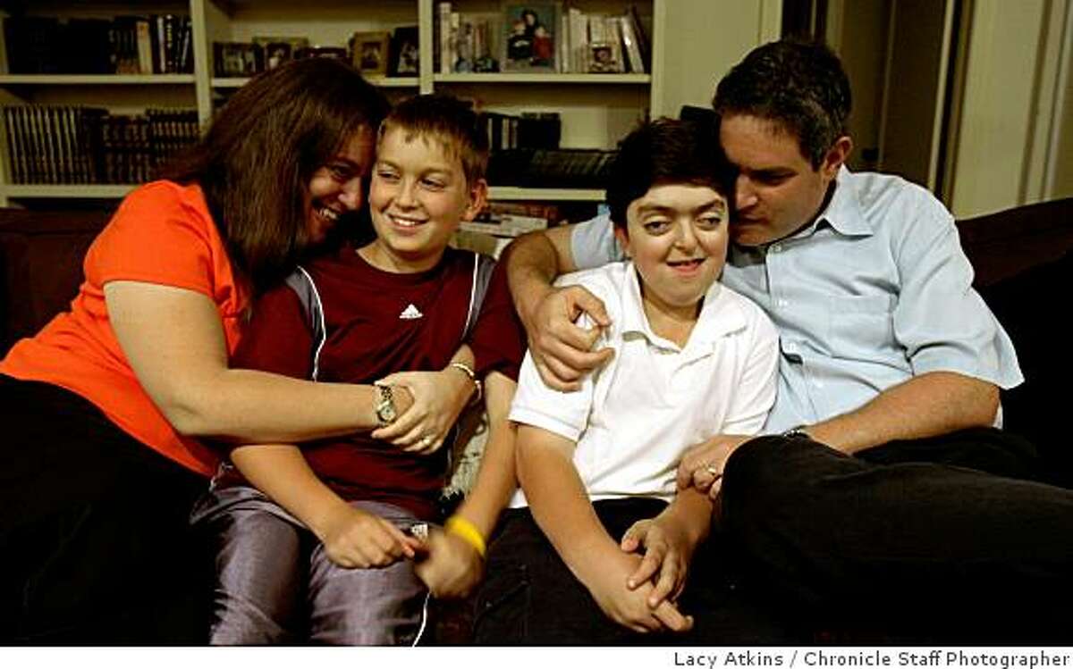 Lisa Wise with sons, Joshua and Michael, and husband, Steven Weinger, are seen in their Palo Alto home. Wise and her family are pushing for Prop 3, a bond initiative to raise funds for children's hospitals in California.