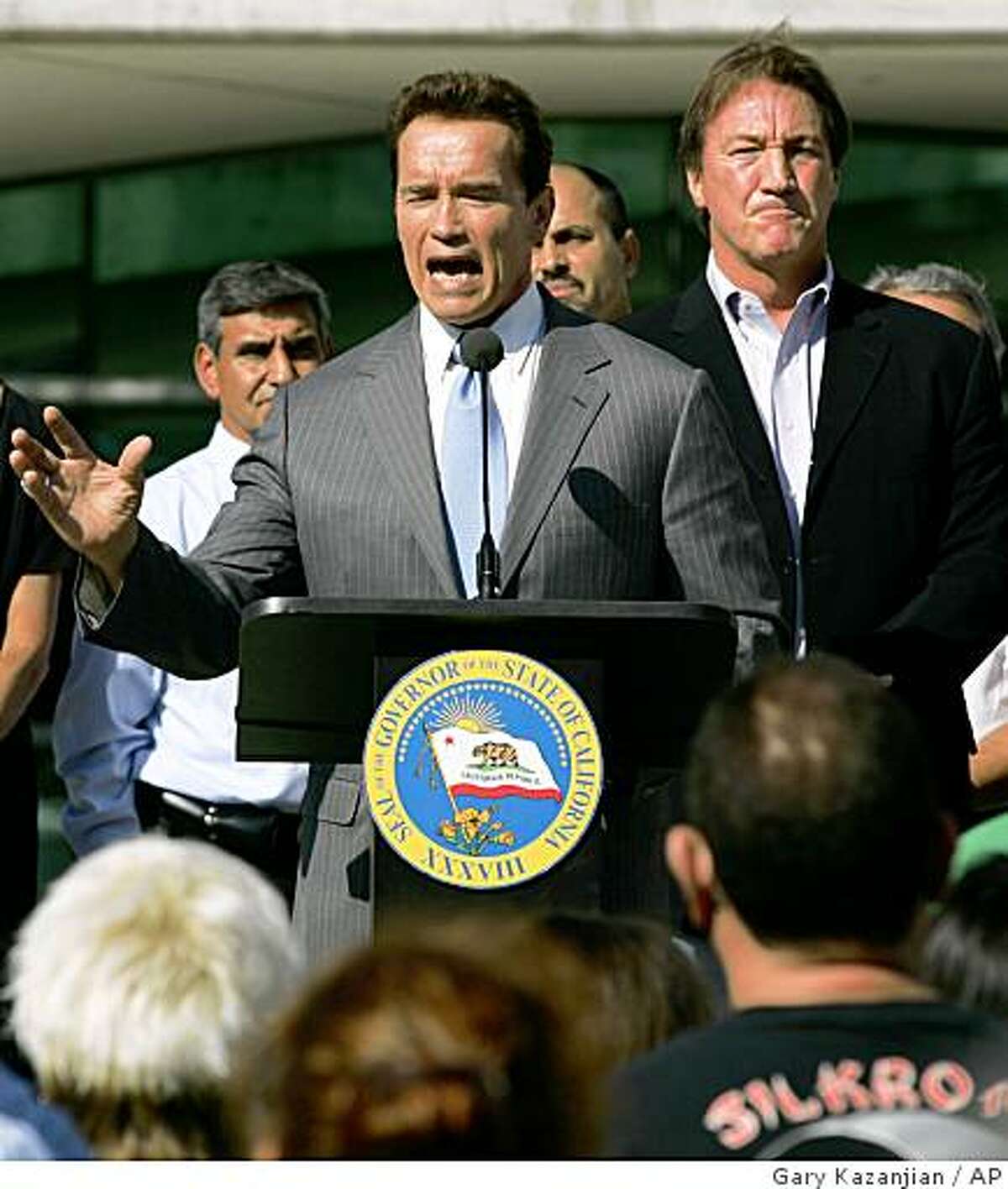 Gov. Arnold Schwarzenegger talks to the crowd at a budget rally as Mayor Alan Autry looks on Wednesday, Sept. 17, 2008 in Fresno, Calif. The state's political dysfunction reached a new low this week with Gov. Arnold Schwarzenegger vowing the first veto of a California budget in modern history. The spat goes beyond the numbers; it's about what may be the governor's last chance to hammer out a fiscal legacy. (AP Photo/Gary Kazanjian)