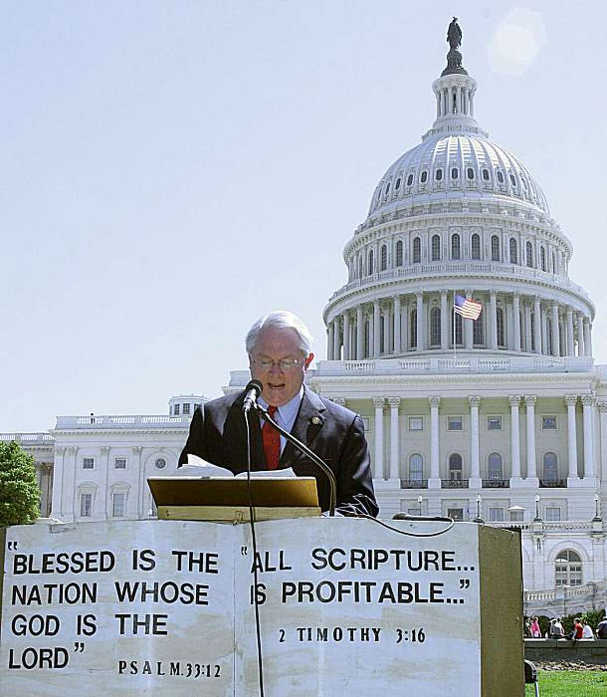 (FILES) US Rep. Randy Neugebauer, R-TX, reads the Bible in this May 2, 2006 file photo during the 16th US Capitol Bible Reading Marathon on the West Lawn of the US Capitol in Washington, DC. A US lawmaker opposed to President Barack Obama's health care overhaul on grounds it would lead to government funding for abortion apologized March 22, 2010 for shouting "baby killer" at backers of the bill.The admission from Republican Representative Randy Neugebauer of Texas solved a short-lived Washington mystery that had lawmakers, aides, and the media alike seeking out who hurled the charge during the House's Sunday debate.