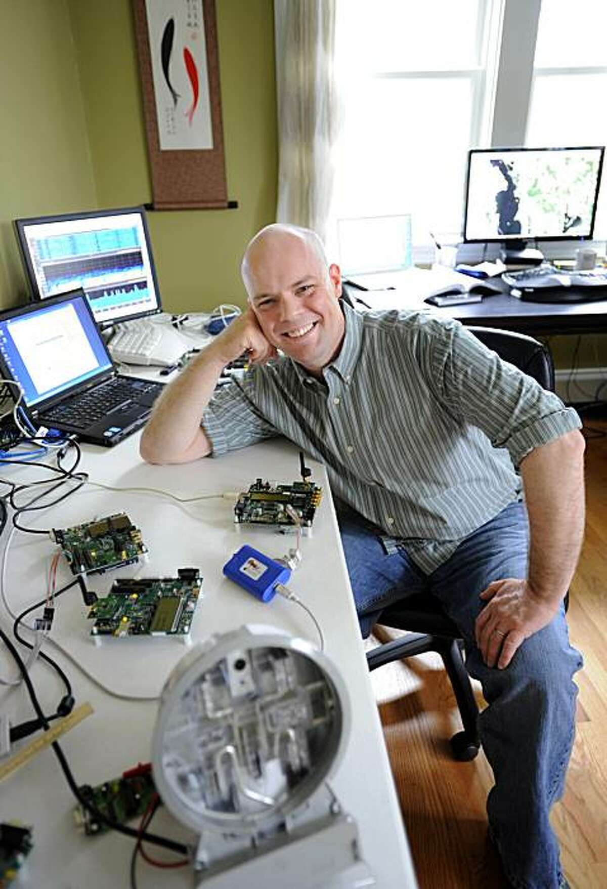 Joshua Wright, a senior security analyst for InGuardians, poses for a portrait with his hacking tools in his office in East Providence, R.I., Friday, March 26, 2010. InGuardians, which was hired by three utility companies, found flaws in new "smart" meters being installed at homes and businesses across the U.S.