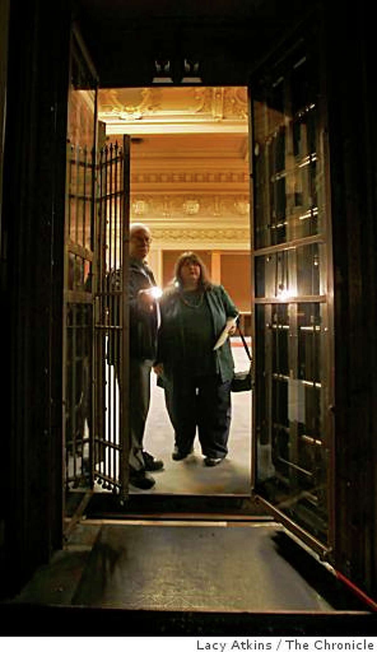 Len Shapiro and Linda Giannecchini look through the vault in the Hibernia Bank building, Tuesday Aug. 19, 2008, in San Francisco, Calif. The building is up for sale for 3.99 million dollars and people are consider it as a cultural center, a home for various arts and entertainment museums, and a cornerstone to the revitalized Upper Market/Tenderloin/Civic Center districts.
