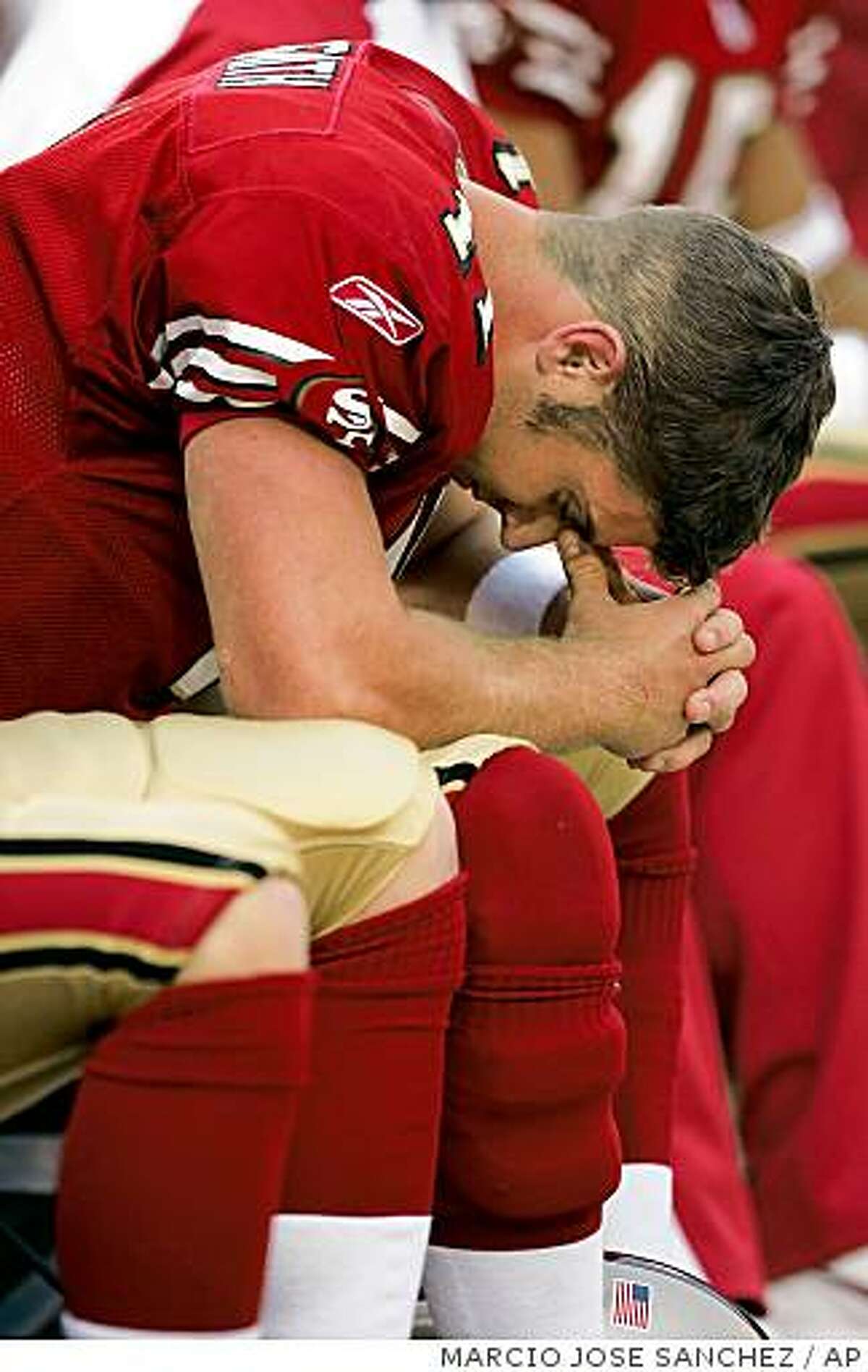 San Francisco 49ers quarterback Alex Smith lowers his head on the sideline in the closing seconds of the 49ers' 17-10 loss to the Arizona Cardinals on Sunday, Dec. 4, 2005, in San Francisco. (AP Photo/Marcio Jose Sanchez)