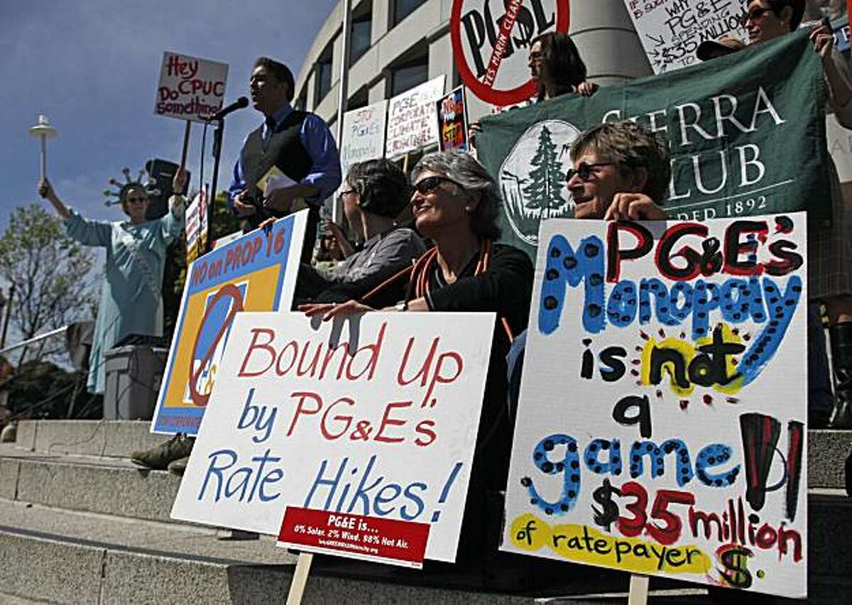 Kathy Callaway, second from right of Woodacre, Calif., and Julia Bartlett, right, of Pt. Reyes Station, Calif., take part in a protest against Proposition 16 outside the California Public Utilities Commission offices in San Francisco, Wednesday, March 17,2010. The California PUC heard public testimony Wednesday on a June ballot initiative that would make it much harder for local governments to create or expand public power agencies. Proposition 16 would change the state constitution to require a two-thirds vote before local governments can use taxpayer funds to create or expand publicly owned utilities.