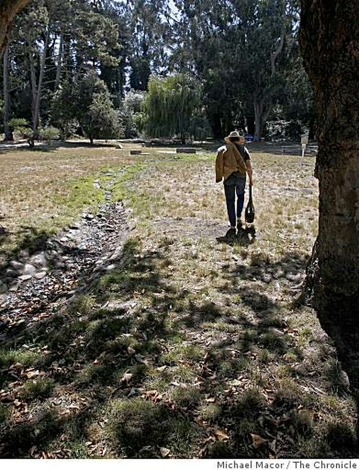A San Francisco resident walks across the open space of the Tennessee Hollow watershed in the Presidio of San Francisco, Calif. on Sept. 5, 2008 where he enjoys days of watching birds or just relaxing in the surrounding area.