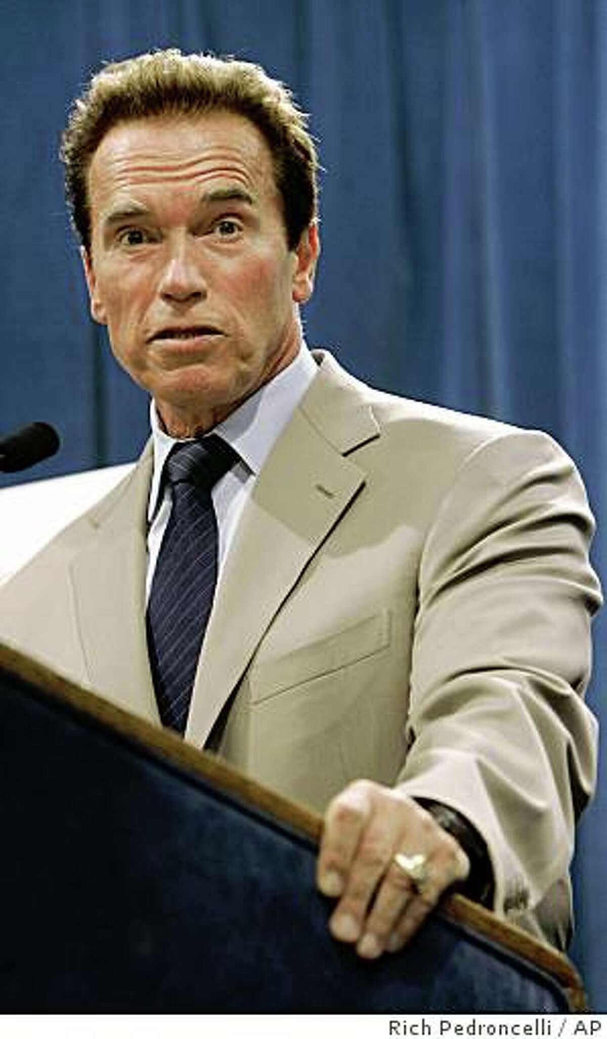 Gov. Arnold Schwarzenegger answers a question concerning the state's response to a magnitude-5.4 earthquake that struck the area earlier in the day, during a news conference in Sacramento, Calif., Tuesday, July 29, 2008. Schwarzenegger said the state was assessing levees, bridges, power lines, roads and hospitals but that no major damage had been reported. (AP Photo/Rich Pedroncelli)