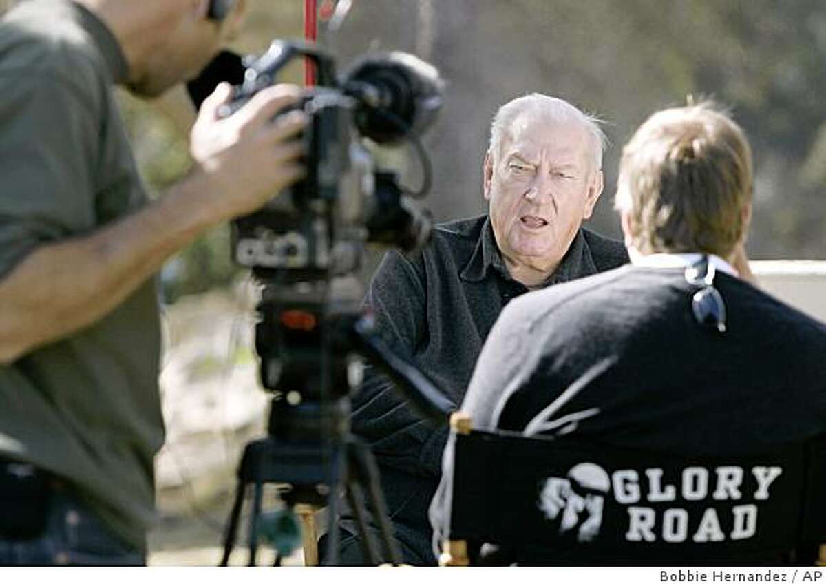 ** FILE ** In this Nov. 8, 2004 file photo, Don Haskins, head basketball coach for the University of Texas at El Paso, center, speaks during an interview with the Glory Road production crew in El Paso, Texas. Haskins died Sunday, Sept. 7, 2008 at the age of 78. (AP Photo/Bobbie Hernandez, File)