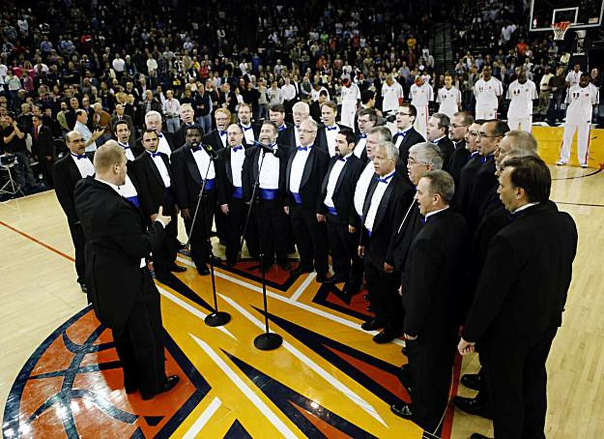 The Oakland Gay Men's Chorus sings the national anthem before the Warrior's basketball game against the Portland Trail Blazers at Oracle Arena in Oakland, Calif., on Thursday, March 11, 2010. The Golden State Warriors hosted their first Lesbian, Gay, Bi-Sexual and Transgender Night. A portion of ticket proceeds went to Positive Resource Center, an AIDS organization.