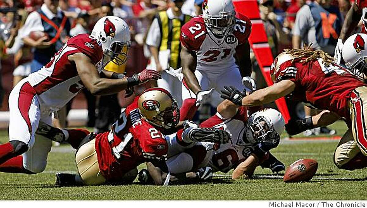 San Francisco 49ers Frank Gore (21) fumbles the ball which was recovered by Arizona in the 2nd quarter as the San Francisco 49ers take a loss against the Arizona Cardinals, 23-10 at Candlestick Park in San Francisco, Calif., on Sept. 7,2008.