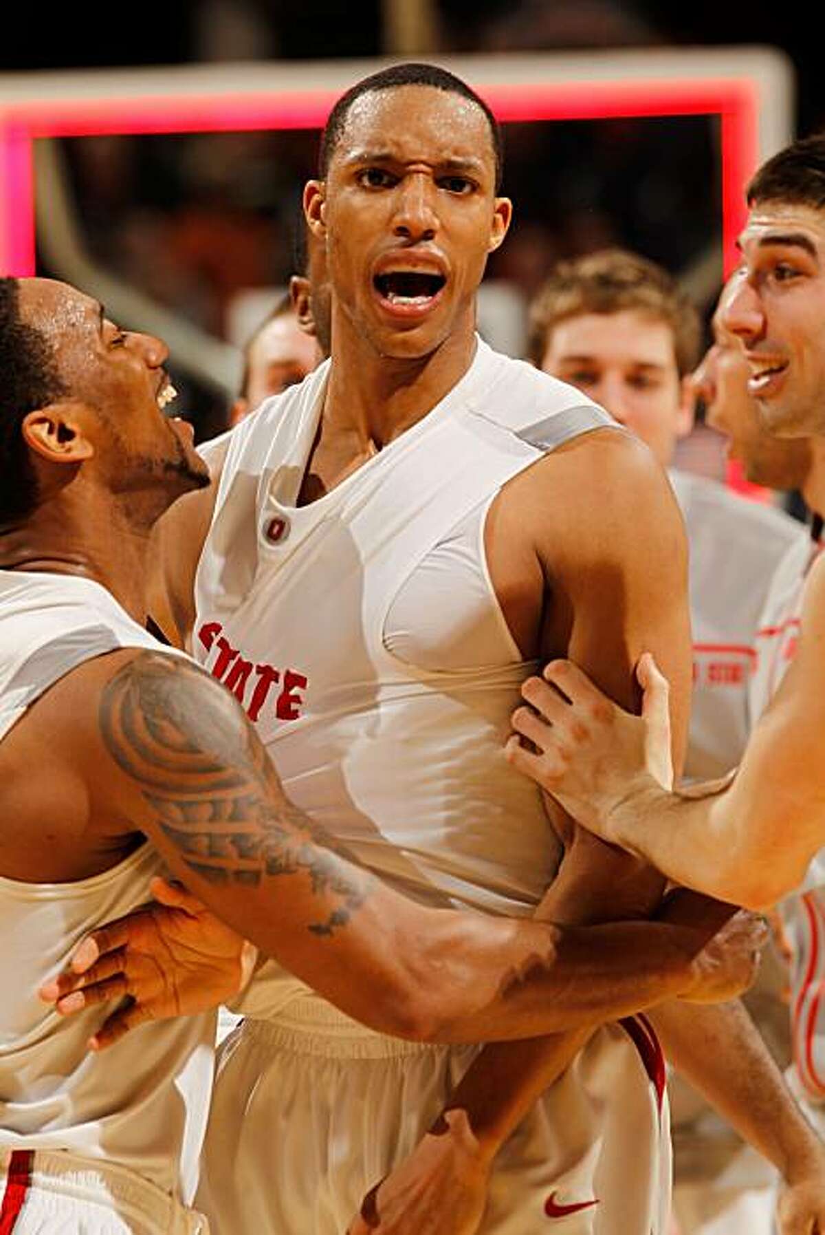 INDIANAPOLIS - MARCH 12: Guard Evan Turner #21 of the Ohio State Buckeyes celebrates with his teammates after making a game winning three point basket to win their quarterfinal game against the Michigan Wolverines in the Big Ten Men's Basketball Tournament at Conseco Fieldhouse on March 12, 2010 in Indianapolis, Indiana.